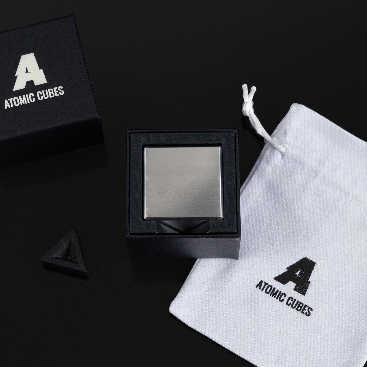 2.0-Inch Niobium Cube with its box, stand and drawstring bag