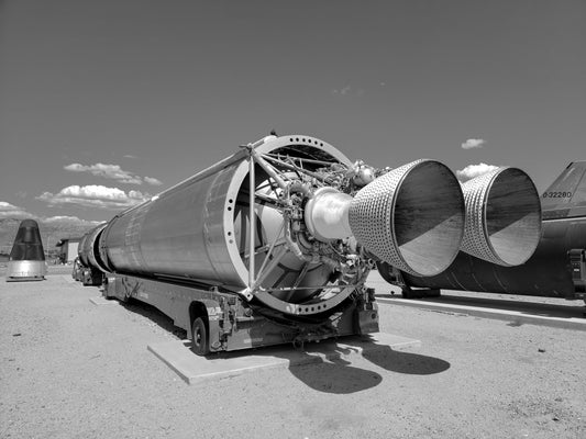 rocket engine with thruster nozzles coated in tungsten film