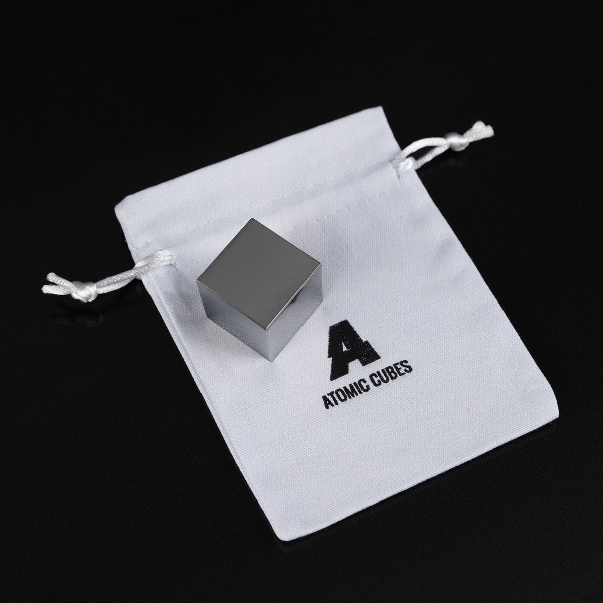 1.0-Inch Niobium Cube with its drawstring bag