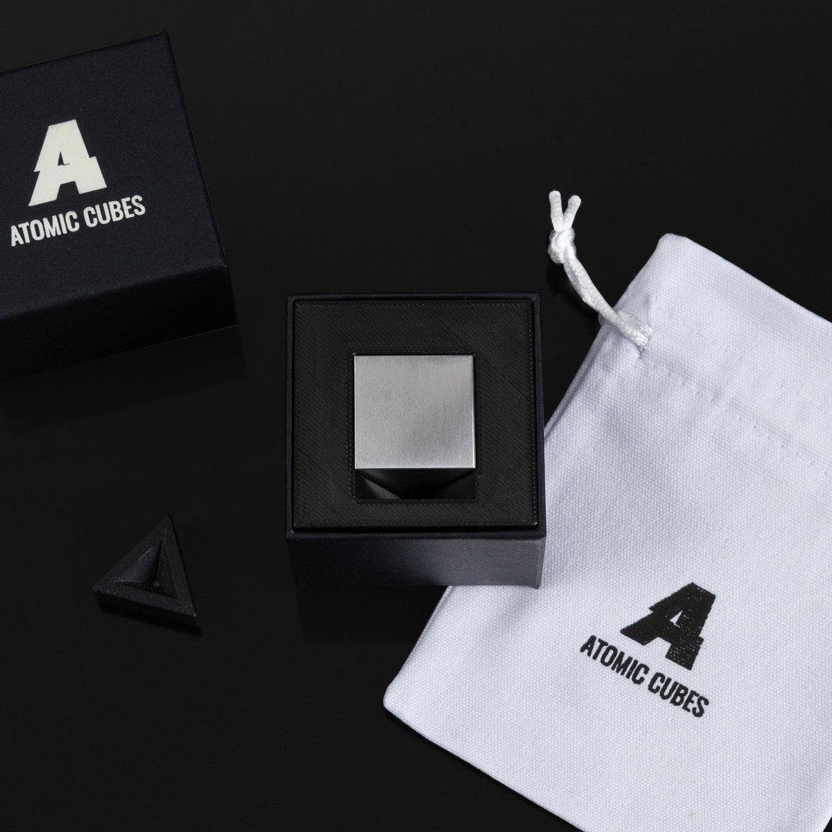 1.0-Inch Niobium Cube with its box, stand and drawstring bag