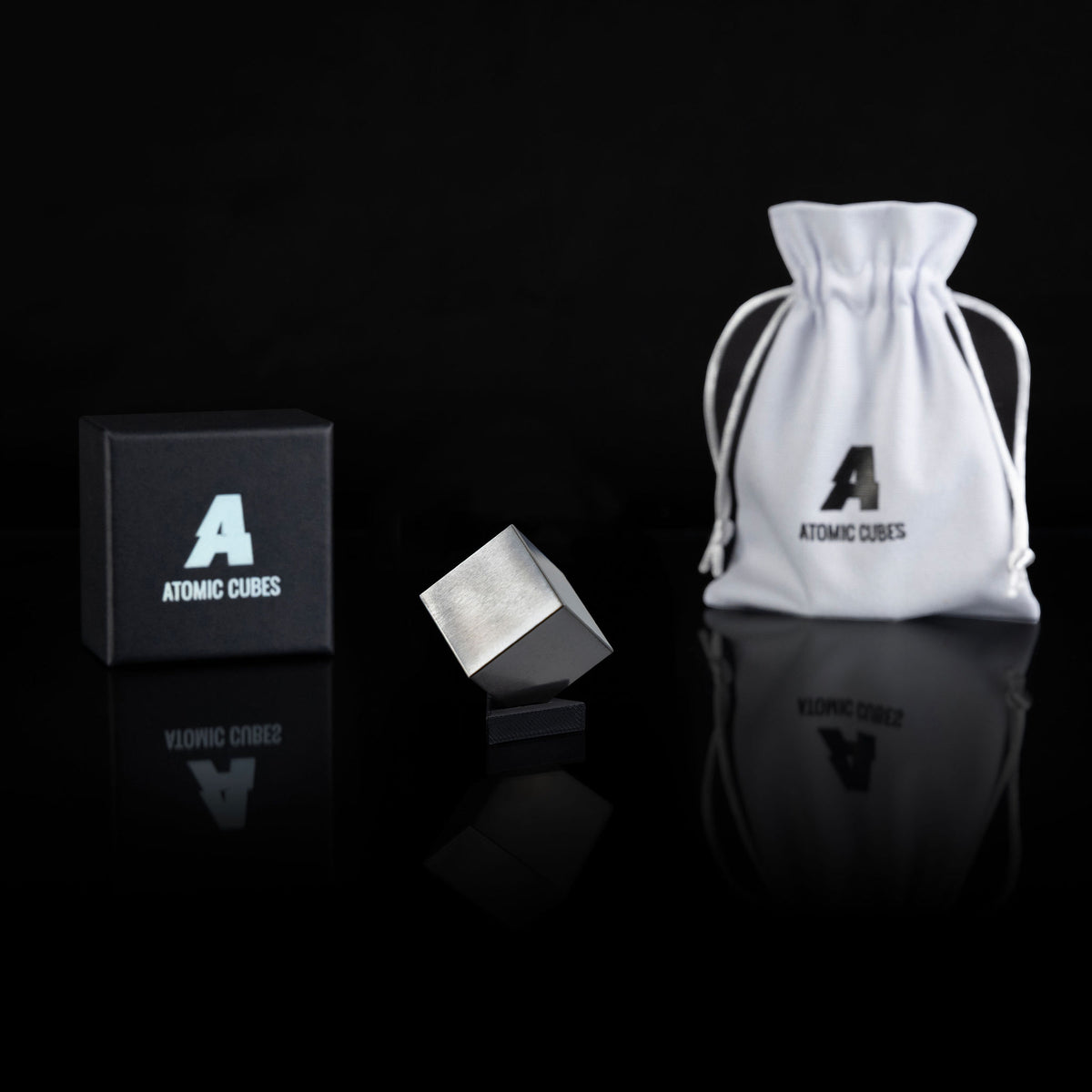 1.0-Inch Niobium Cube with its box, stand and drawstring bag