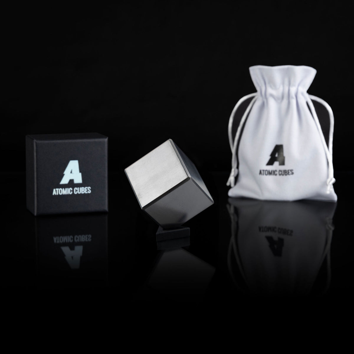 2.0-Inch Niobium Cube with its box, stand and drawstring bag