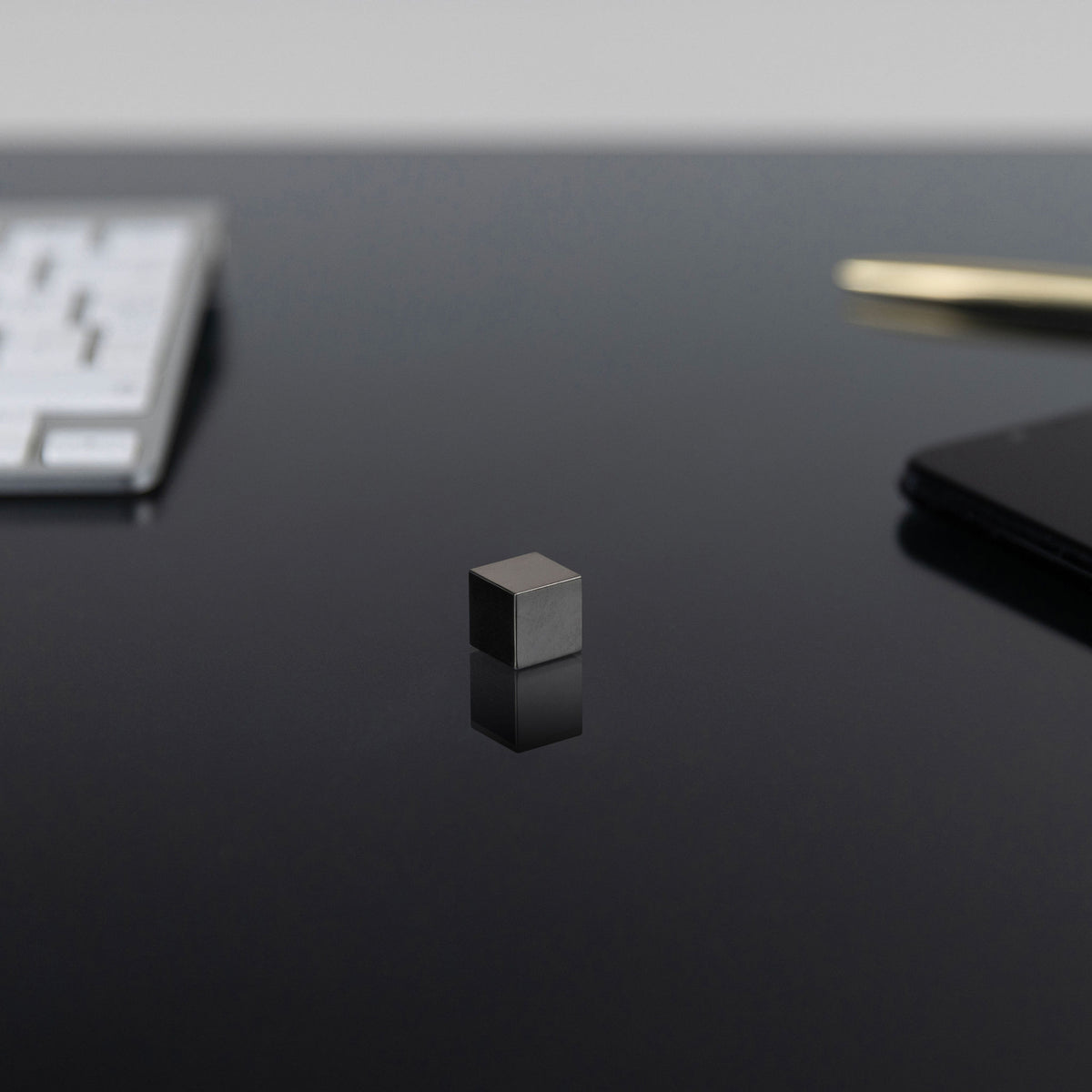 0.5-Inch Niobium Cube on a black background
