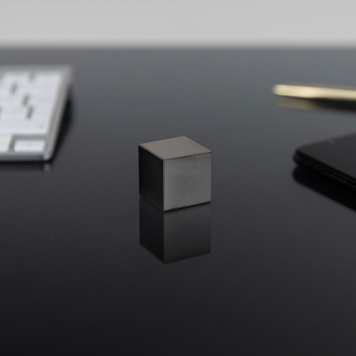 1.0-Inch Niobium Cube on a black background