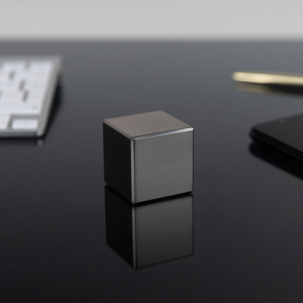 1.5-Inch Niobium Cube on a black background